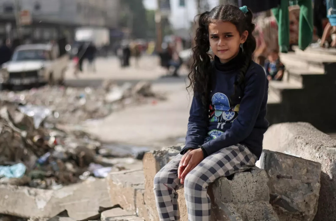 Feb donation to unicef - kid in war surroundings