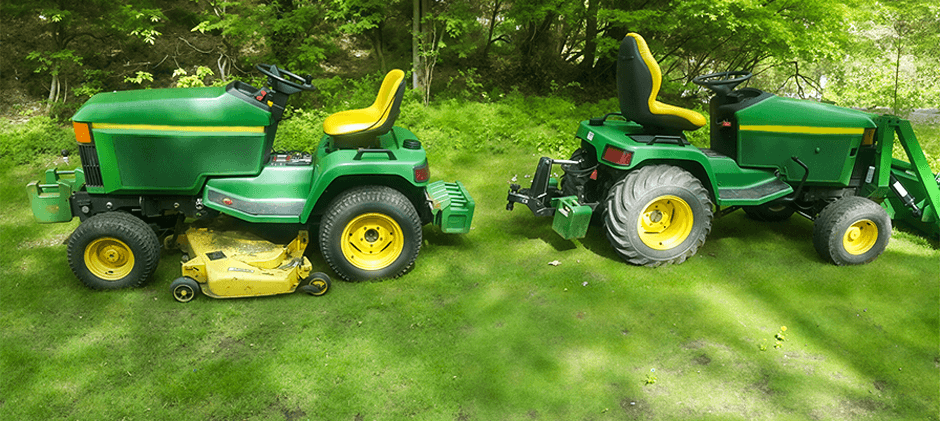 Two John Deere Z445 mowers in lawn