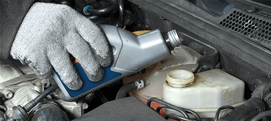 A-person-is-inspecting-the-brake-fluid-for-the-replacement equipment.
