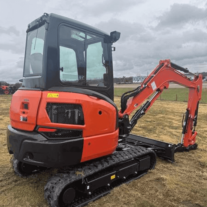 Kubota K-Series: Power and Stability A Kubota K-Series mini excavator with an enclosed cab, illustrating its conventional tail swing design with a larger rear counterweight.