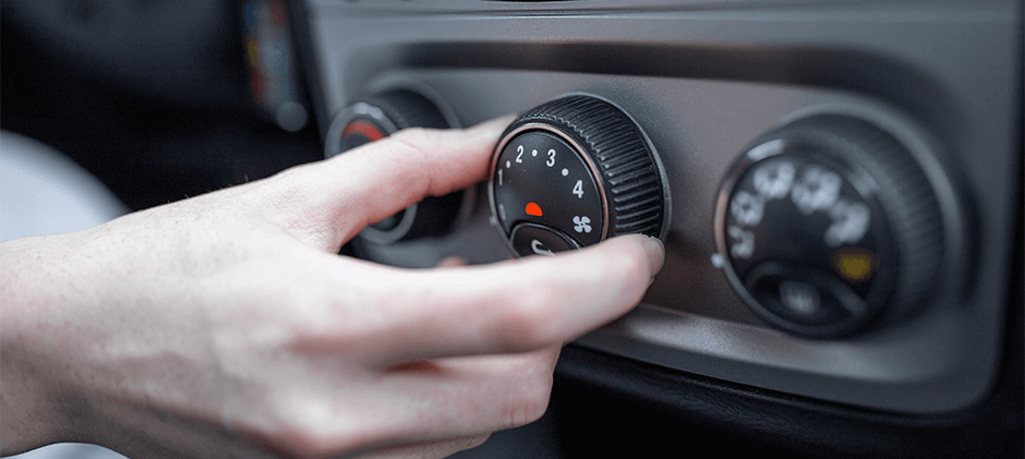 A-person-is-adjusting-the-indoor-air-conditioning-temperature-in-the-cockpit.
