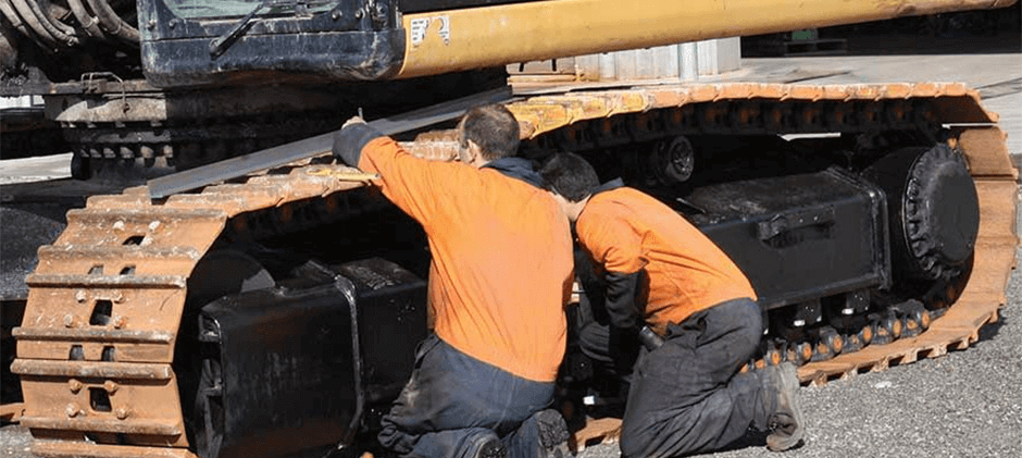 Inspect the undercarriage parts of the excavator