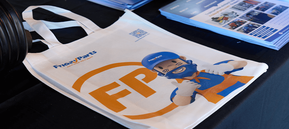 A FridayParts handbag with our mascot character on a table at the Sunbelt AG Expo.
