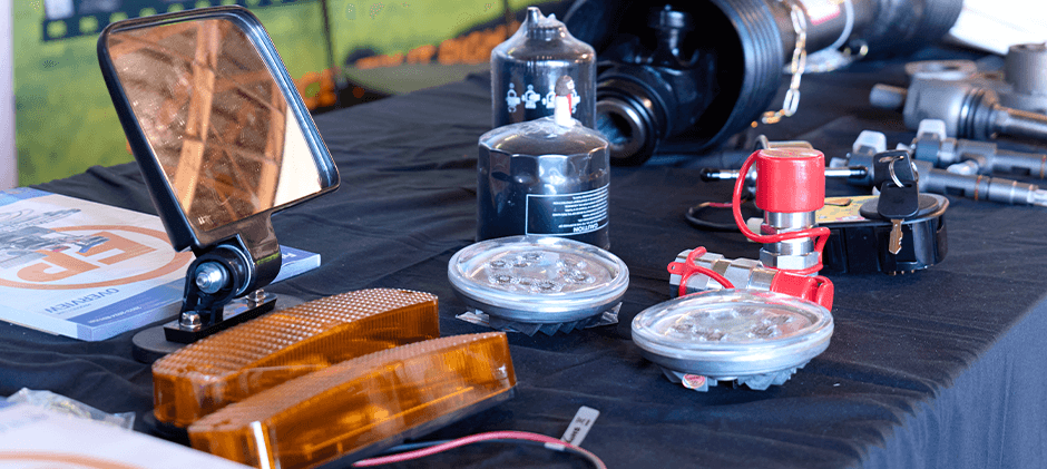 A display of FridayParts aftermarket parts, including LED lights, mirrors, and filters, at our expo booth.
