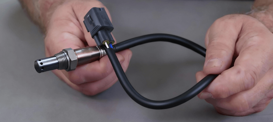 A person holding an oxygen sensor