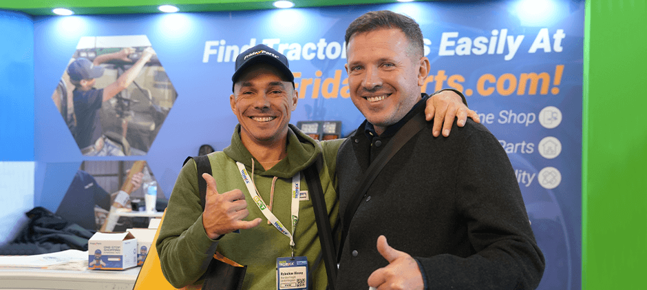 A FridayParts team member and a happy visitor posing together at the FridayParts booth during Agritechnica 2025.