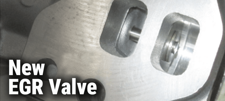 Close-up of the clean, metallic ports on a new EGR valve before installation.