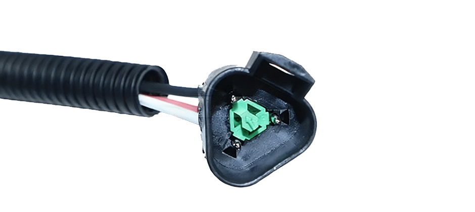 Close-up view of a three-pin throttle position sensor electrical connector, showing the pins used for testing voltage.