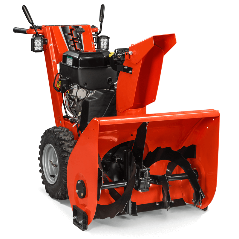 Red two-stage snow blower with heavy-duty tires and steel auger.
