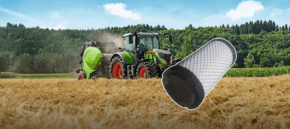 A tractor baling hay in a dusty field with a close-up of a new, clean engine air filter element in the foreground.