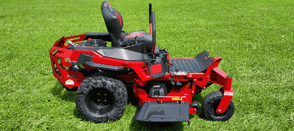 Rear view of a red zero-turn mower highlighting its heavy-duty chassis, large tires, and suspension system.