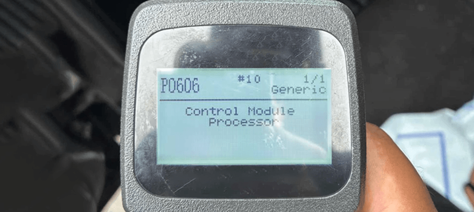 Close-up of an OBD-II scanner screen displaying the generic trouble code P0606, Control Module Processor.