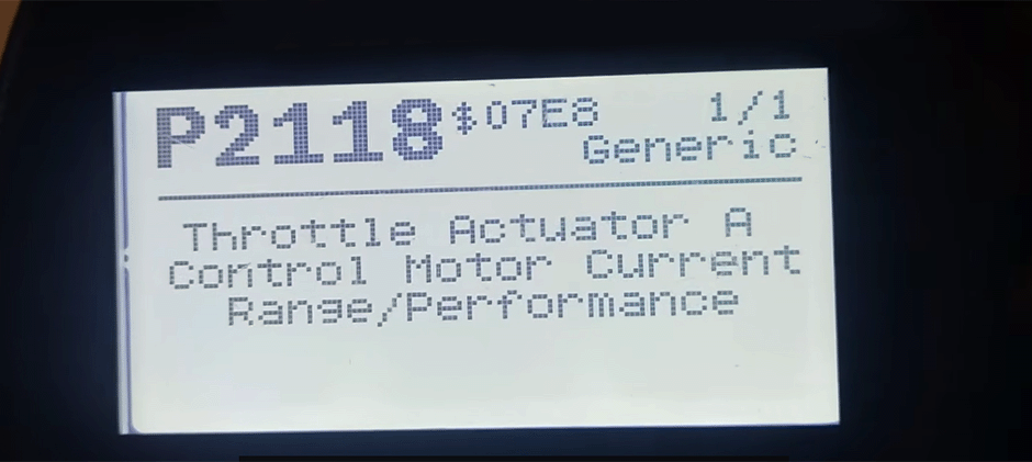 An OBD-II code reader screen displays the definition for trouble code P2118: "Throttle Actuator A Control Motor Current Range/Performance."